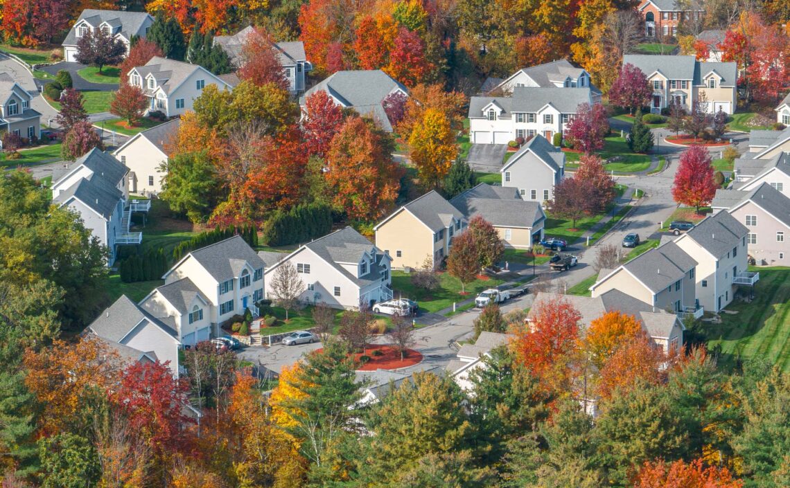 A neighborhood in the fall with leaves turning color